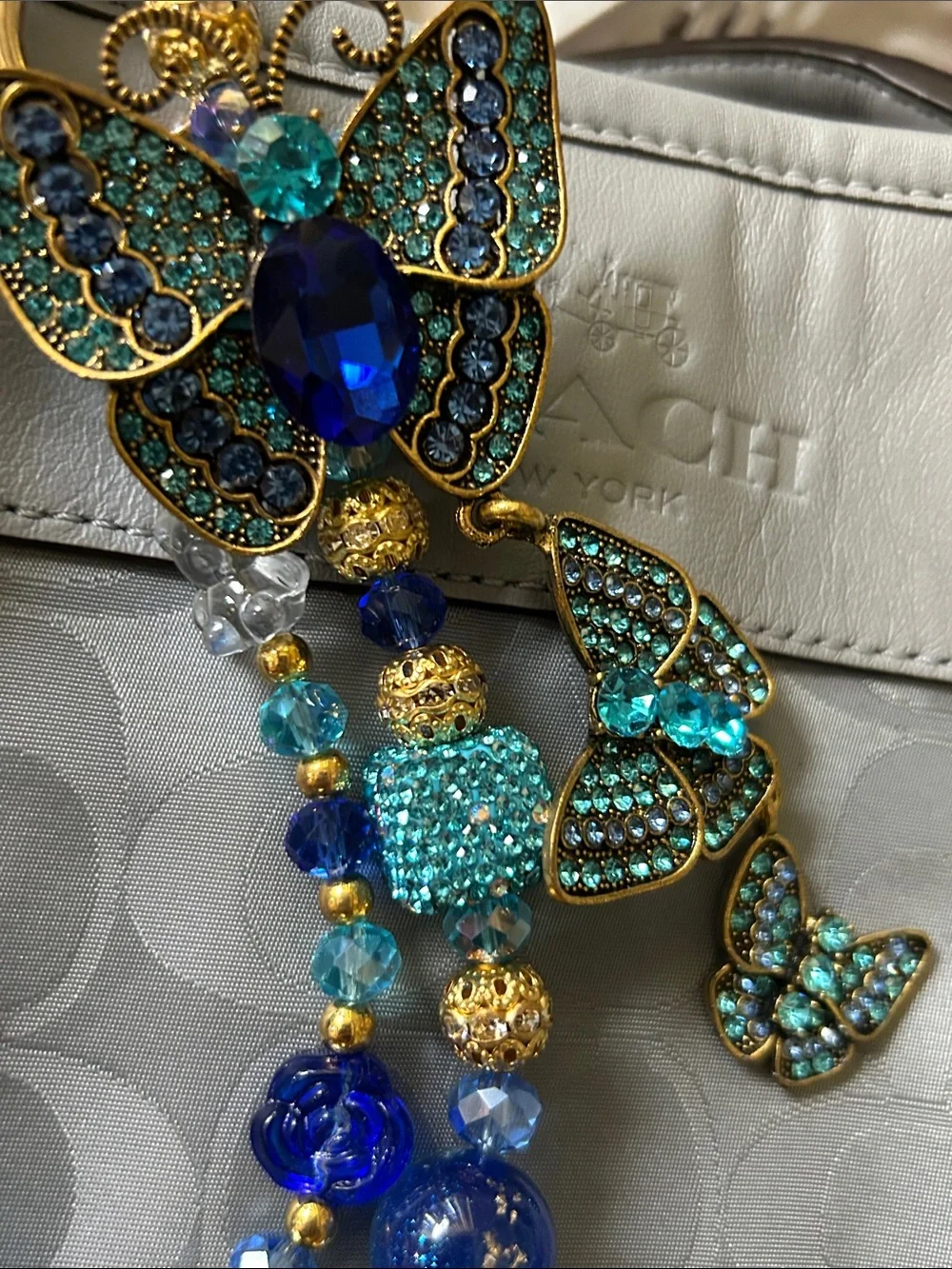 Keychain Blue, Aqua and Gold Beaded Statement Necklace with Butterfly Accent